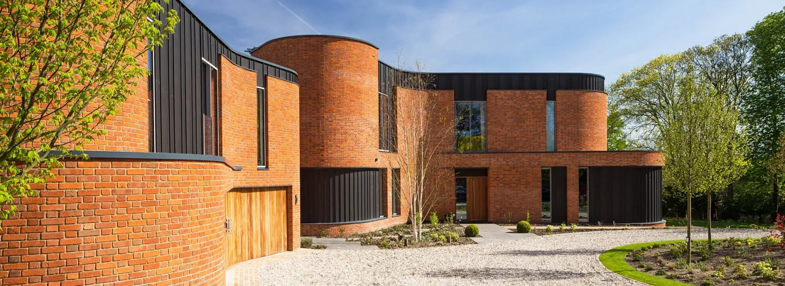Aluminium curved copings and cill flashings used on award winning home. Incurvo building